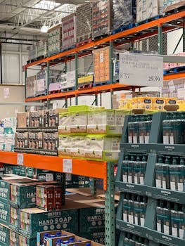 Bulk products displayed on shelves in a wholesale warehouse setting.